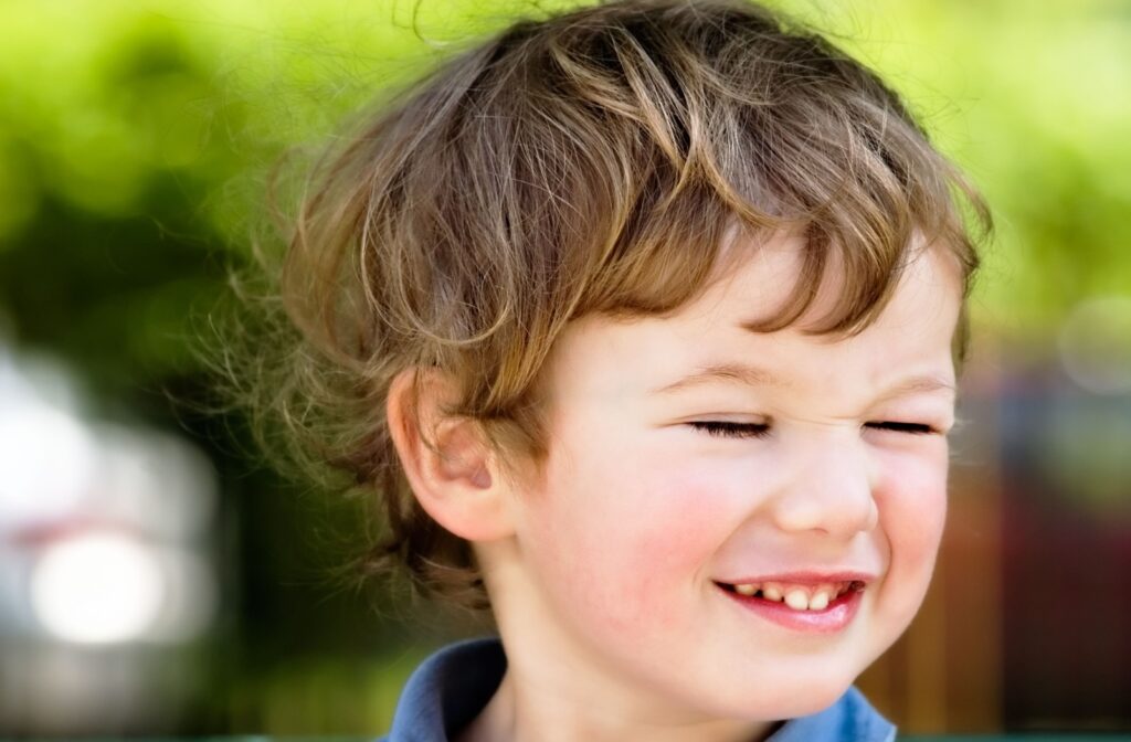 A little boy blinking.